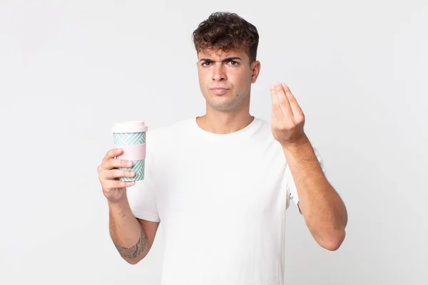 年轻英俊的男人做着花言巧语或金钱的手势 让你付钱 并拿走咖啡 — 图库照片