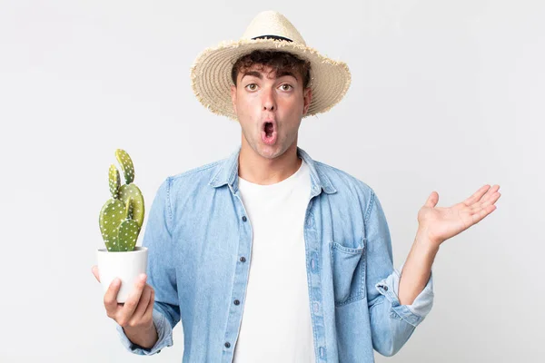 Young Handsome Man Looking Surprised Shocked Jaw Dropped Holding Object — Stock Photo, Image