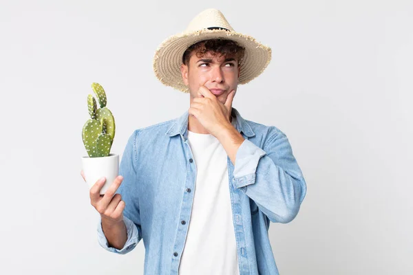 Young Handsome Man Thinking Feeling Doubtful Confused Farmer Holding Decorative — Stock Photo, Image