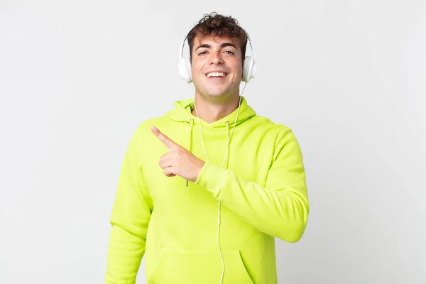 Young Handsome Man Looking Excited Surprised Pointing Side Headphones — Stock Photo, Image