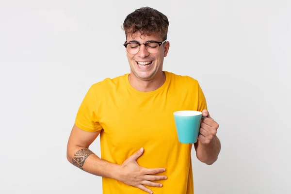 Young Handsome Man Laughing Out Loud Some Hilarious Joke Holding — Stock Photo, Image