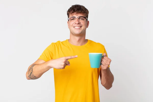 Young Handsome Man Smiling Cheerfully Feeling Happy Pointing Side Holding — Stock Photo, Image