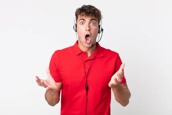 Young Handsome Man Amazed Shocked Astonished Unbelievable Surprise Telemarketer Concept — Stock Photo, Image