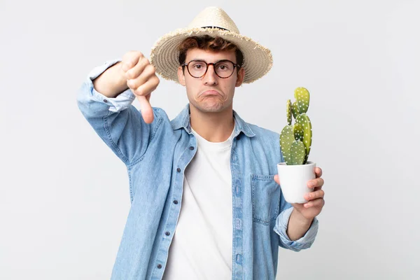 Young Handsome Man Feeling Cross Showing Thumbs Farmer Holding Decorative — Stock Photo, Image