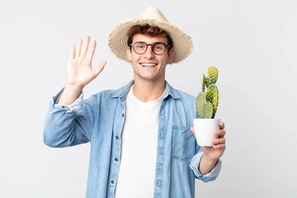 Young Handsome Man Smiling Happily Waving Hand Welcoming Greeting You — Stock Photo, Image