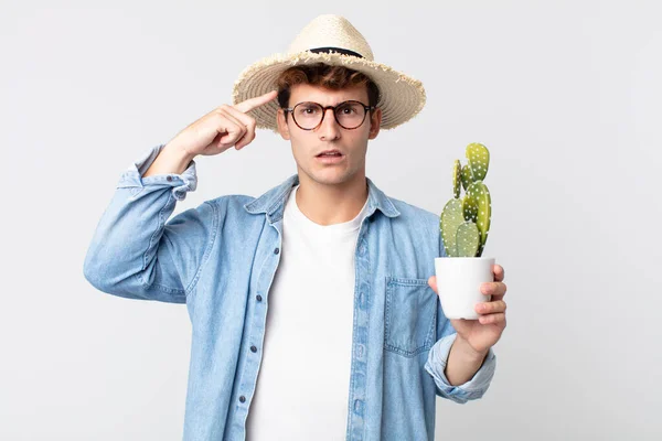 Young Handsome Man Feeling Confused Puzzled Showing You Insane Farmer — Stock Photo, Image