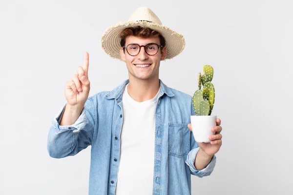 Young Handsome Man Smiling Looking Friendly Showing Number One Farmer — Stock Photo, Image