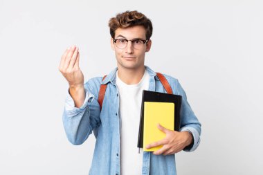 Genç yakışıklı adam kapiş ya da para hareketi yapıyor, sana ödemeni söylüyor. Üniversite öğrencisi konsepti