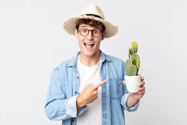 Young Handsome Man Looking Excited Surprised Pointing Side Farmer Holding — Stock Photo, Image