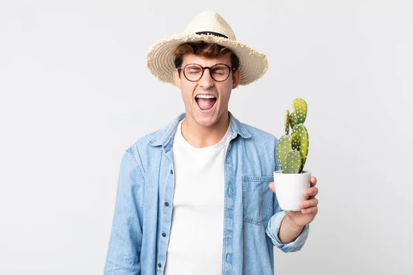 Young Handsome Man Shouting Aggressively Looking Very Angry Farmer Holding — Stock Photo, Image