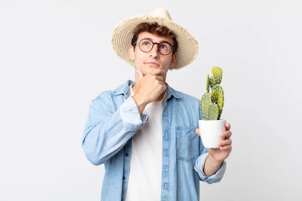 Young Handsome Man Thinking Feeling Doubtful Confused Farmer Holding Decorative — Stock Photo, Image