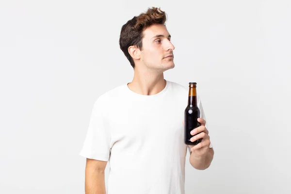 Young Handsome Man Profile View Thinking Imagining Daydreaming Holding Beer — Stock Photo, Image