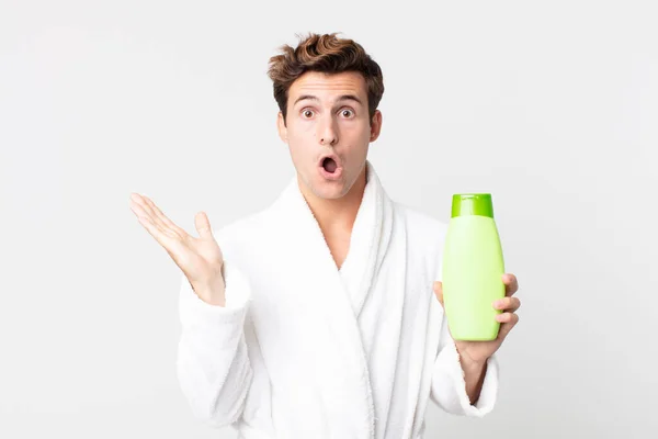 Young Handsome Man Looking Surprised Shocked Jaw Dropped Holding Object — Stock Photo, Image