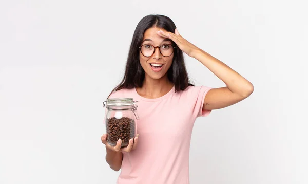 Young Hispanic Woman Looking Happy Astonished Surprised Holding Coffee Beans — Stock Photo, Image