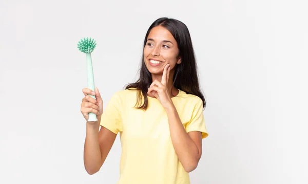 Young Hispanic Woman Smiling Happily Daydreaming Doubting Holding Dish Cleaning — Stock Photo, Image
