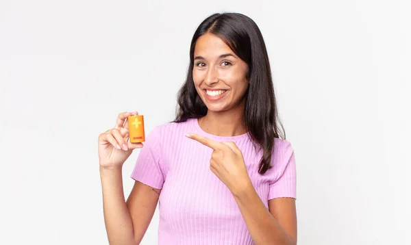 Young Hispanic Woman Looking Excited Surprised Pointing Side Holding Batteries — Stock Photo, Image