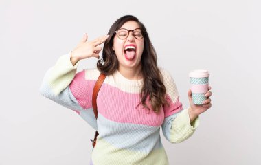 Güzel bir kadın mutsuz ve stresli görünüyor, intihar jesti silah işareti yapıyor. öğrenci konsepti