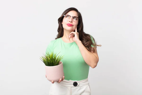 Pretty Woman Smiling Happily Daydreaming Doubting Holding Decorative Plant — Stock Photo, Image