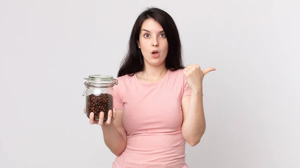 Pretty Woman Looking Astonished Disbelief Holding Coffee Beans Bottle — Stock Photo, Image