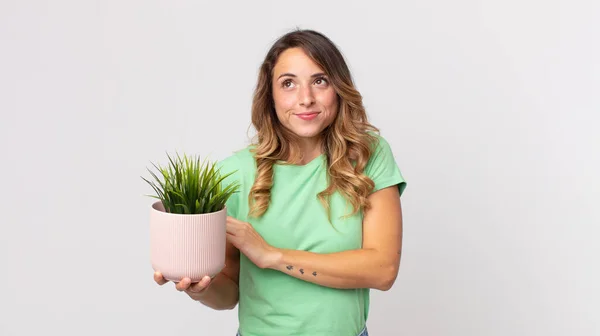 Pretty Thin Woman Shrugging Feeling Confused Uncertain Holding Decorative Plant — Stock Photo, Image