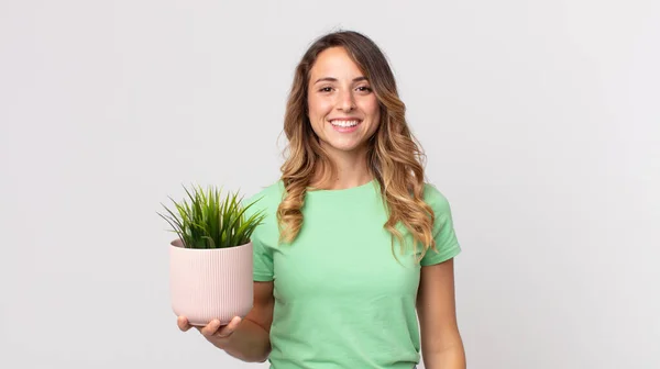 Pretty Thin Woman Looking Happy Pleasantly Surprised Holding Decorative Plant — Stock Photo, Image