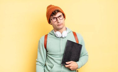 feeling puzzled and confused, with a dumb, stunned expression looking at something unexpected. student concept