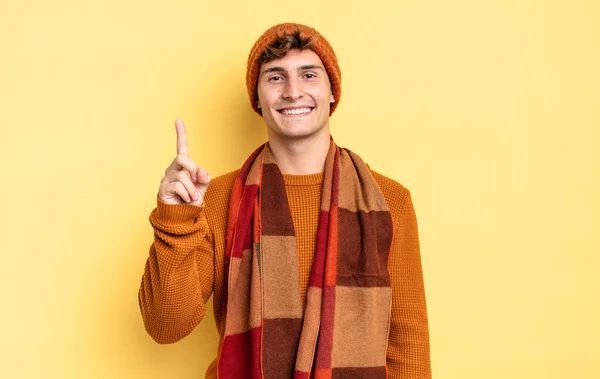 Young Teenager Boy Smiling Looking Friendly Showing Number One First — Stock Photo, Image