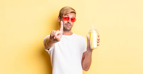 Blond Adult Man Smiling Looking Friendly Showing Number One Milkshake — Stock Photo, Image