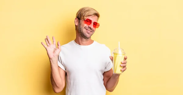 Blond Adult Man Smiling Happily Waving Hand Welcoming Greeting You — Stock Photo, Image