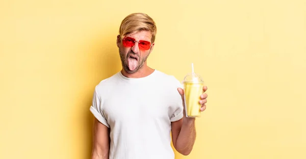 Blond Adult Man Feeling Disgusted Irritated Tongue Out Milkshake — Stock Photo, Image