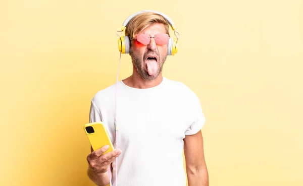 Blond Adult Man Cheerful Rebellious Attitude Joking Sticking Tongue Out — Stock Photo, Image