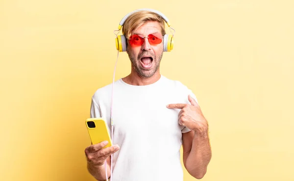 Blond Adult Man Feeling Happy Pointing Self Excited Headphones — Stock Photo, Image