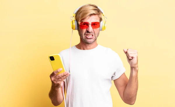 Blond Adult Man Shouting Aggressively Angry Expression Headphones — Stock Photo, Image