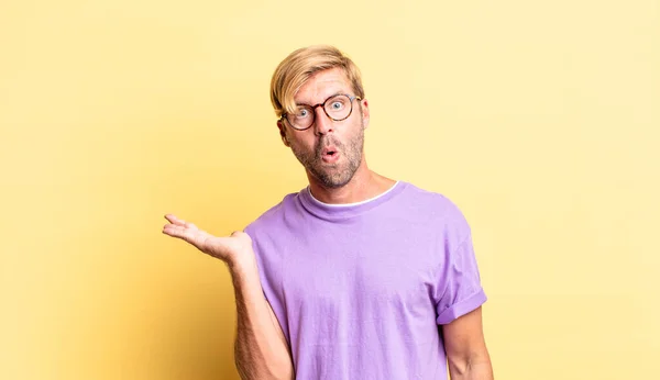 Handsome Blond Adult Man Looking Surprised Shocked Jaw Dropped Holding — Stock Photo, Image