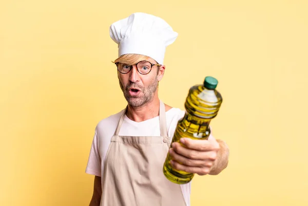 Blonde Handsome Chef Adult Man Holding Olive Oil Bottle — Stock Photo, Image