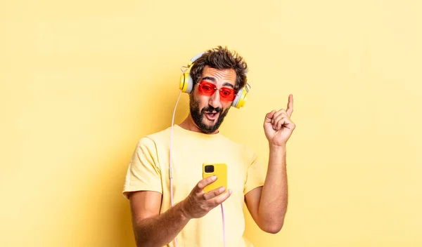 Expressive Crazy Bearded Man Listening Music Headphones Sartphone — Stock Photo, Image