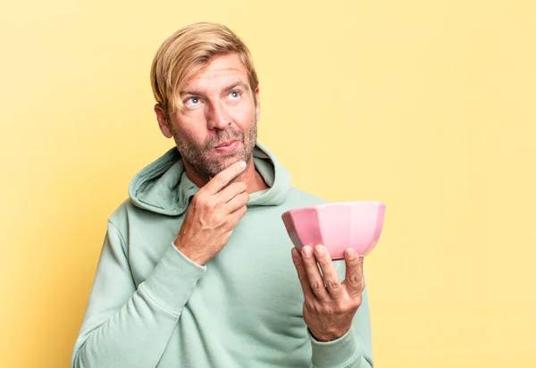 Blonde Handsome Adult Man Holding Empty Pot Yellow Wall — Stock Photo, Image