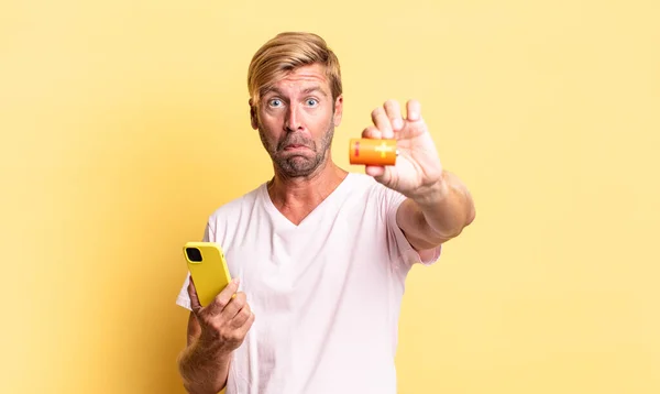 Blonde Handsome Adult Man Holding Batterie — Stock Photo, Image