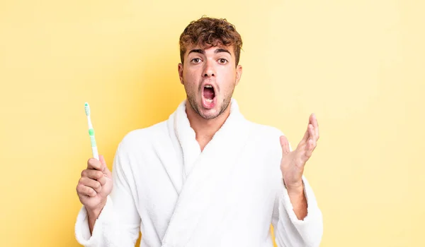 Young Handsome Man Amazed Shocked Astonished Unbelievable Surprise Toothbrush Concept — Stock Photo, Image