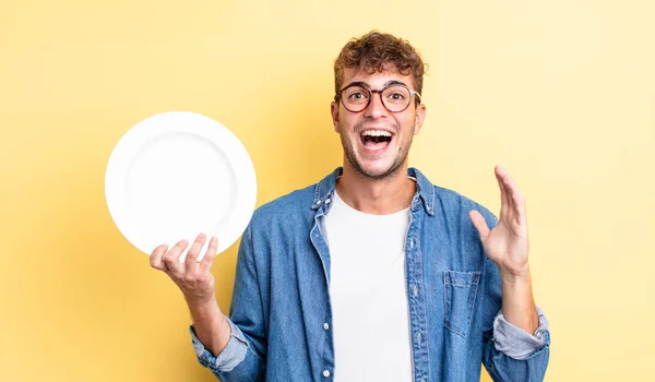Young Handsome Man Feeling Happy Astonished Something Unbelievable Empty Dish — Stock Photo, Image