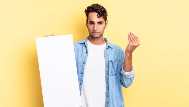 İspanyol yakışıklı adam kapiş ya da para hareketi yapıyor, sana ödemeni söylüyor. boş tuval kavramı