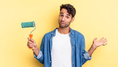 İspanyol yakışıklı adam şaşkın, şaşkın ve şüpheci hissediyor. paten boya kavramı