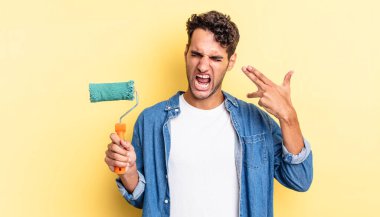 İspanyol yakışıklı adam mutsuz ve stresli görünüyor, intihar jesti silah işareti yapıyor. paten boya kavramı