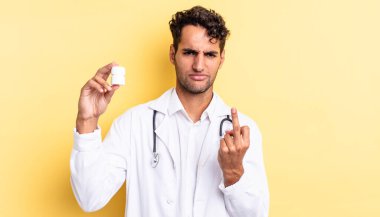 İspanyol yakışıklı adam kızgın, sinirli, asi ve agresif hissediyor. Hekim şişesi hapları konsepti