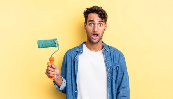 Hispanic Handsome Man Looking Very Shocked Surprised Roller Paint Concept — Stock Photo, Image