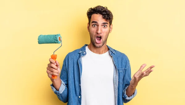 Hispanic Handsome Man Feeling Extremely Shocked Surprised Roller Paint Concept — Stock Photo, Image