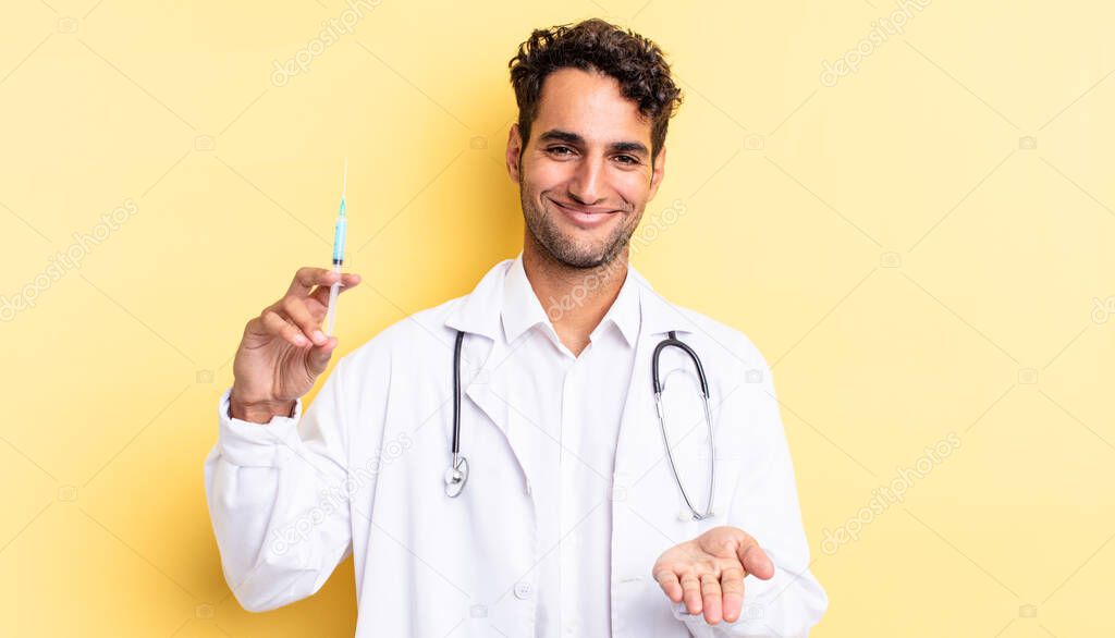 hispanic handsome man smiling happily with friendly and  offering and showing a concept physician and srynge concept