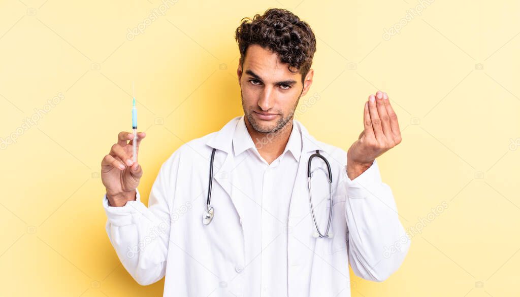 hispanic handsome man making capice or money gesture, telling you to pay physician and srynge concept