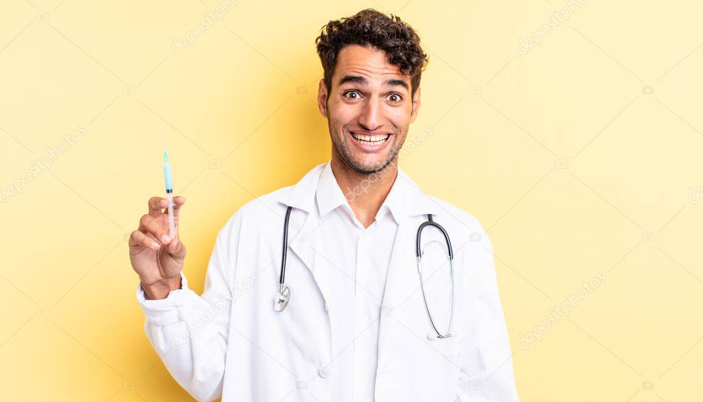 hispanic handsome man looking happy and pleasantly surprised physician and srynge concept