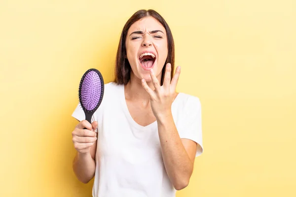 Young Hispanic Woman Looking Desperate Frustrated Stressed Hair Brush Concept — Stock Photo, Image